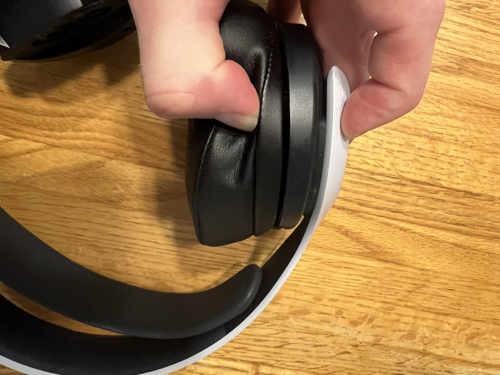 How to hold the earpad and headset to get the last clips to engage