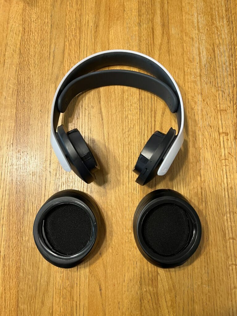 Both ear pads with rings inside next to headset