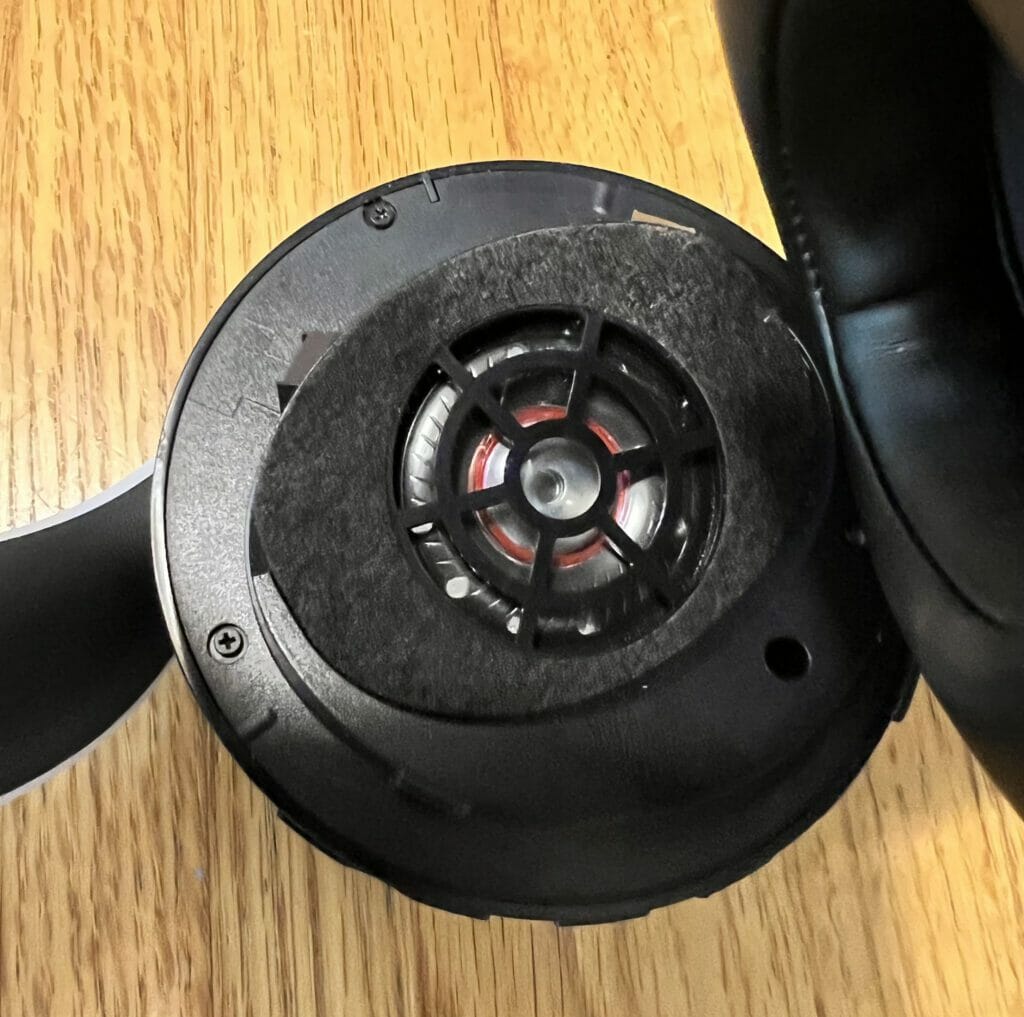 The drivers (speakers) exposed after cutting and peeling away the mesh material
