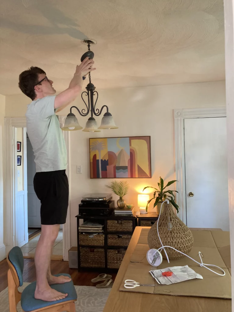 Me standing on a chair taking off the old light
