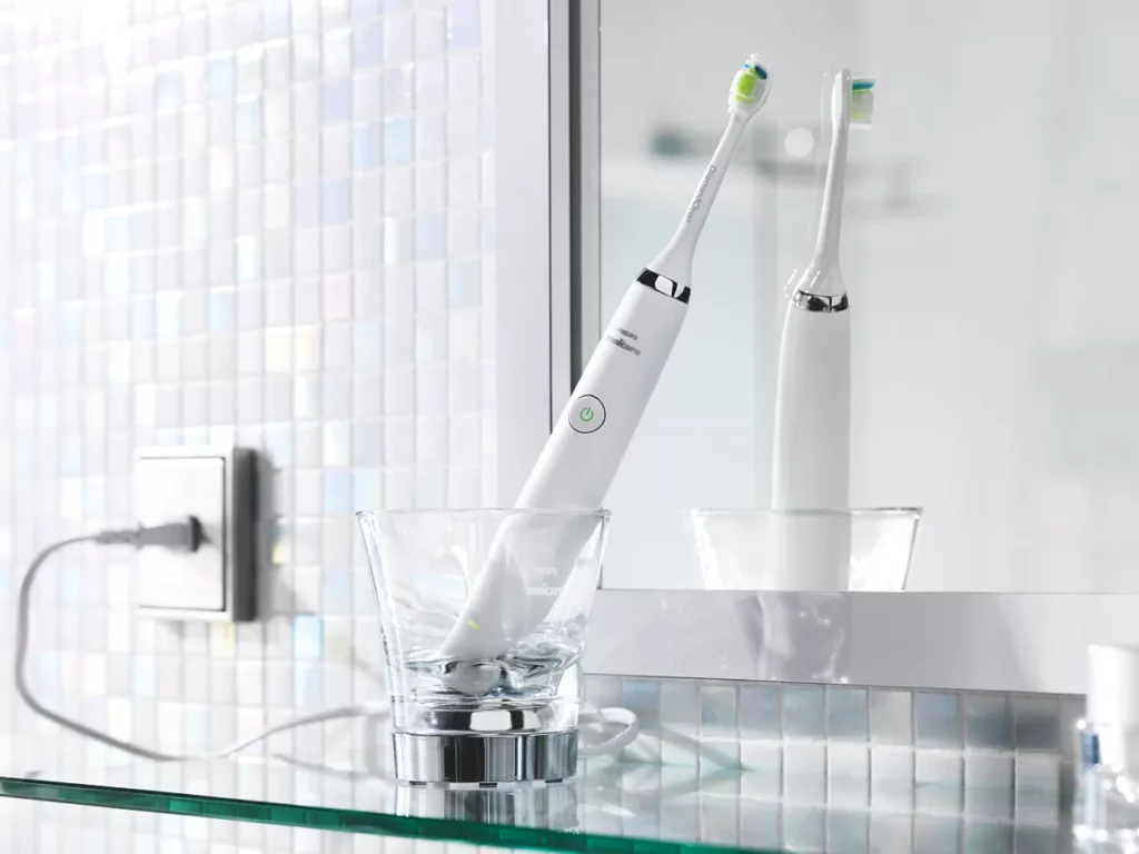 An older Sonicare DiamondClean in its charging glass