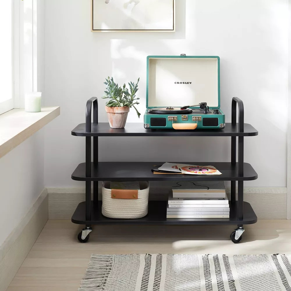 The Brightroom rack which is similar to the Open Spaces rack, shown with some items on the shelves. In this photo no grooves are on the shelf, even though it seems that it does in fact come with grooves.
